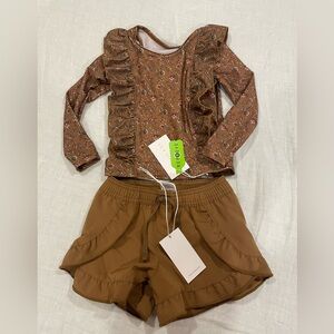 Jaimie Kay Size 6-12 months swim set. Shorts and long sleeved rashguard.